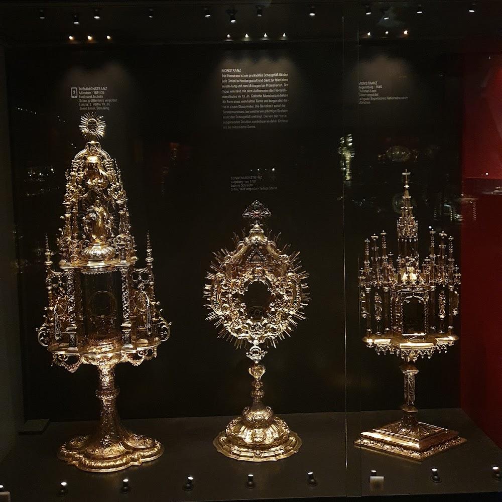 Three golden monstrances on display.